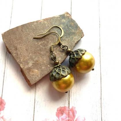 Vintage Inspired Acorn Earrings With A Gold Tone..