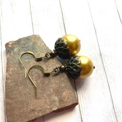 Vintage Inspired Acorn Earrings With A Gold Tone..