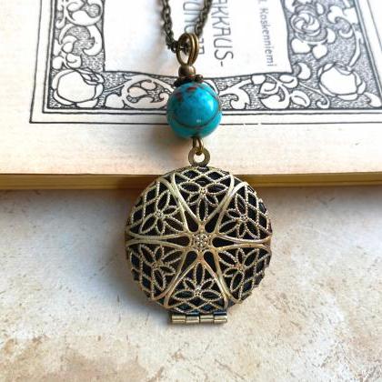 Filigree Locket Necklace With A Turquoise Gemstone..