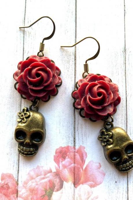Skull earrings with red rose pendants, Day of the Dead jewelry, Selma Dreams