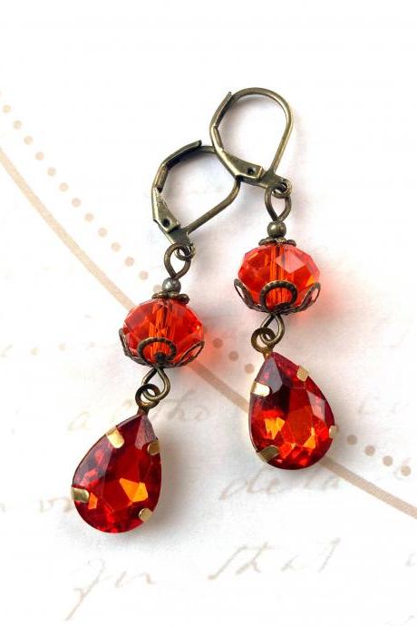 Shimmering earrings with orange glass beads, Selma Dreams